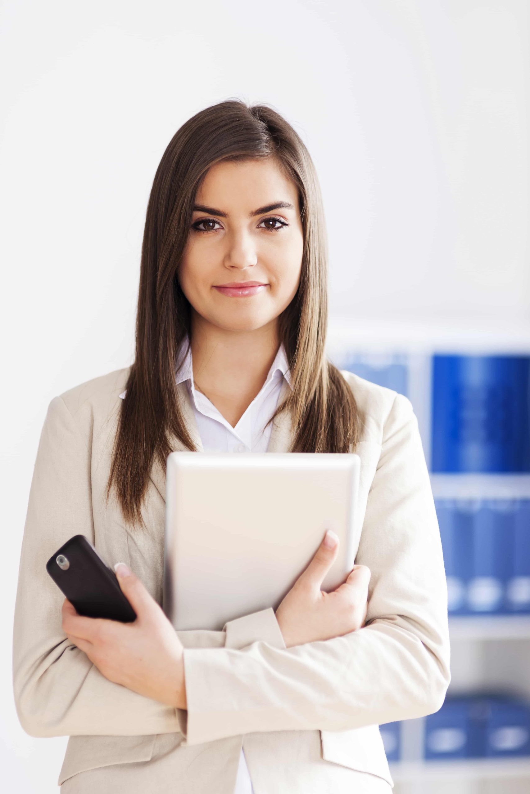 young-businesswoman-holding-digital-tablet-mobile-phone-min